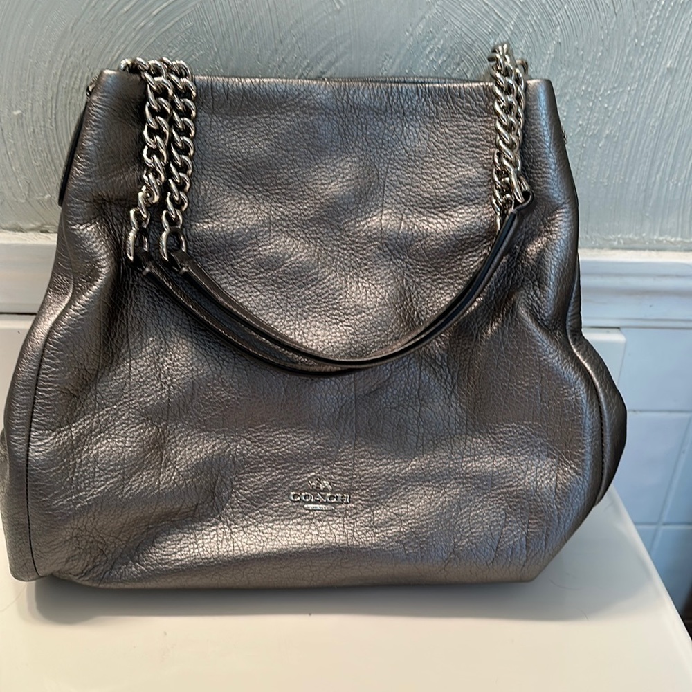 Coach multi compartment pebble leather bag.